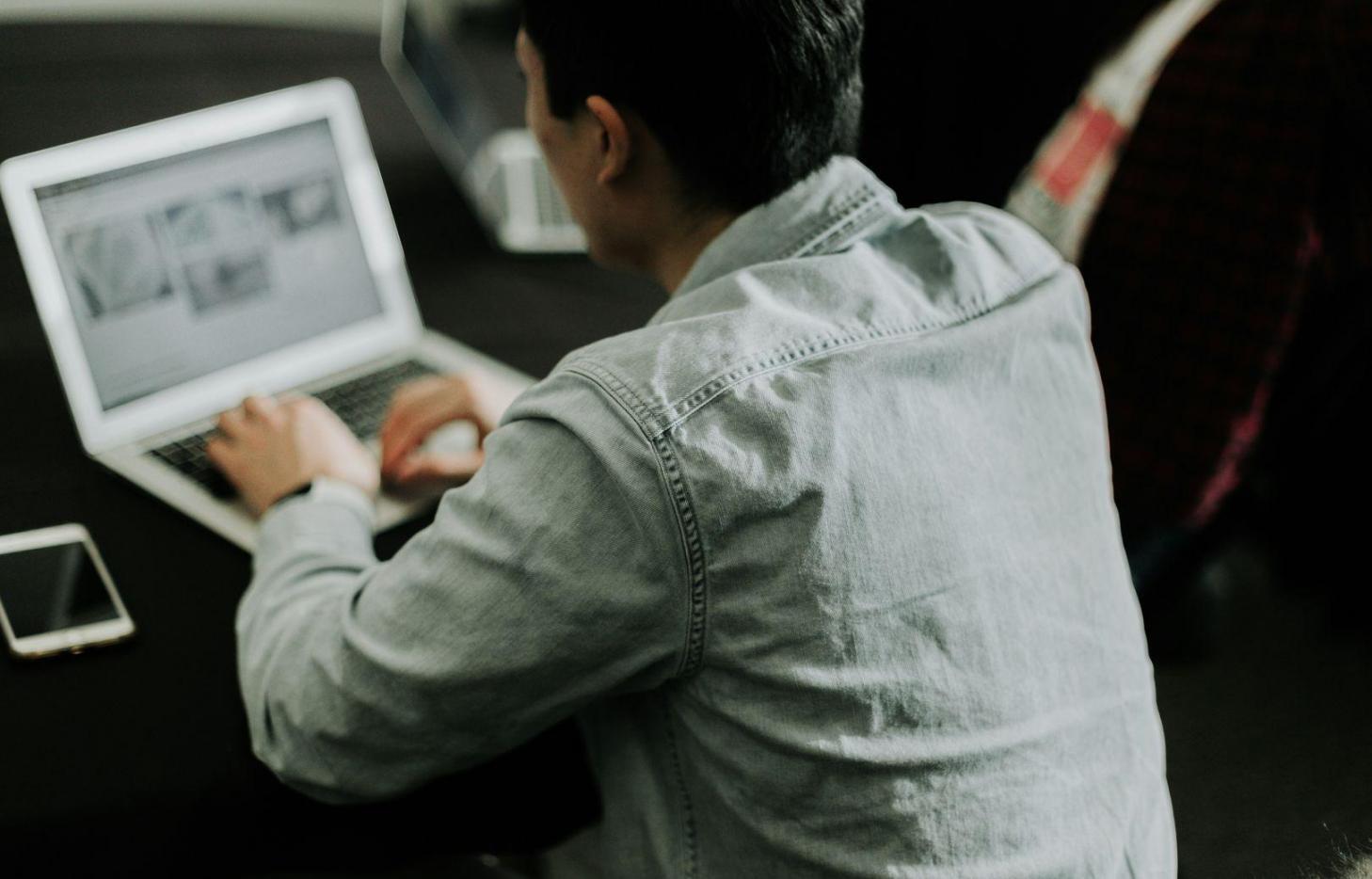 Business owner reviewing financial documents at desk